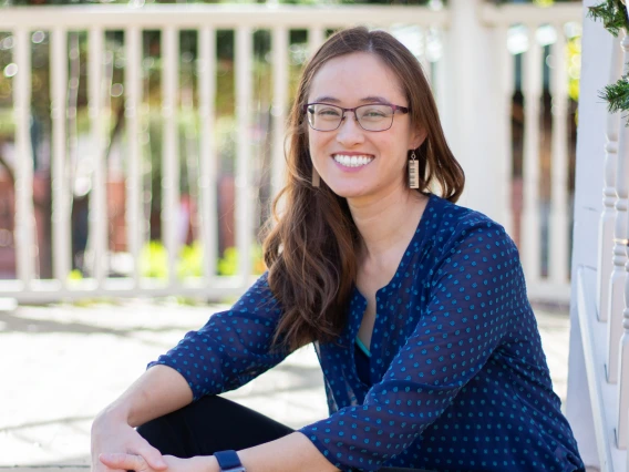 woman sitting on stairs smiling