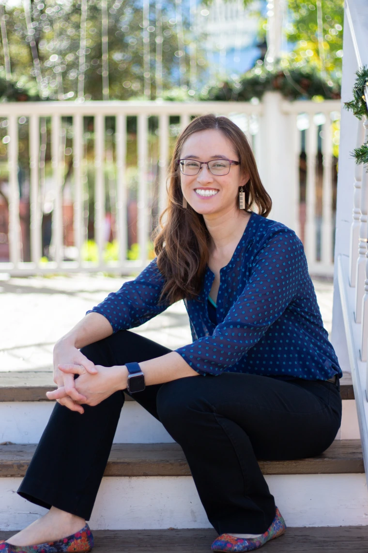 woman sitting on stairs smiling